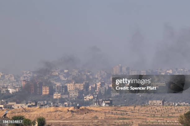 Destroyed homes and buildings of central Gaza smolder as the Israeli Defense Forces continue their bombing campaign against Hamas militants on...