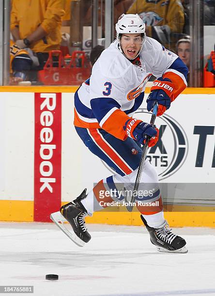 Travis Hamonic of the New York Islanders skates against the Nashville Predators at Bridgestone Arena on October 12, 2013 in Nashville, Tennessee.