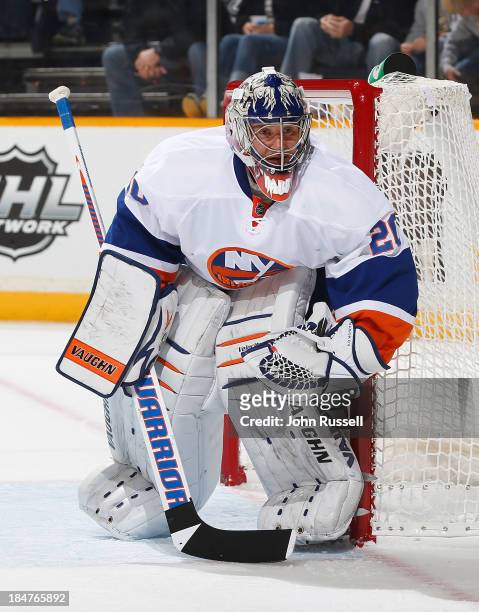Evgeni Nabokov of the New York Islanders minds the net against the Nashville Predators at Bridgestone Arena on October 12, 2013 in Nashville,...