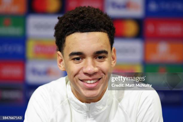 Jamal Musiala of Bayern Munich speaks to the media during a press conference at Old Trafford on December 11, 2023 in Manchester, England.