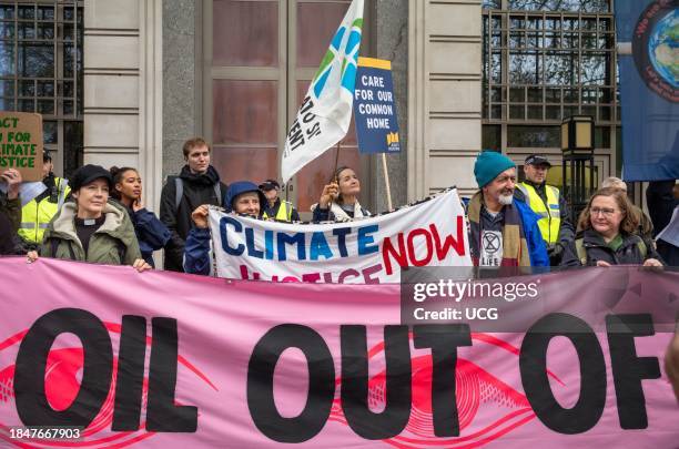 London, UK, 9 Dec 2023, Activists from the Climate Justice Coalition protest outside BP's London HQ at the "#NowWeRise â A Day of Action for Climate...