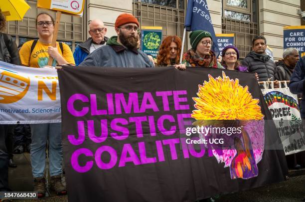 London, UK, 9 Dec 2023, Activists from the Climate Justice Coalition protest outside BP's London HQ at the "#NowWeRise â A Day of Action for Climate...