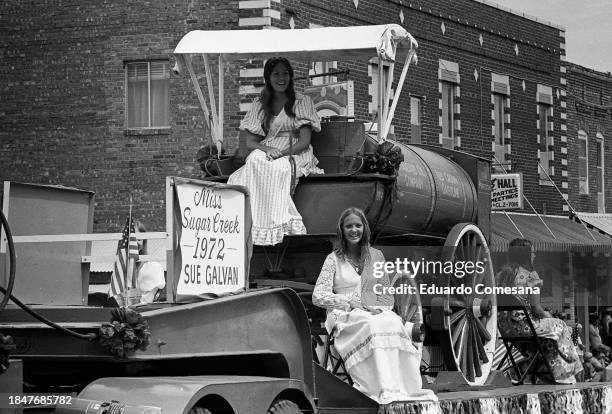 View of beauty pageant contestants, including Miss Sugar Creek Sue Galvan, during an Independence Day Parade, July 4, 1972. Sugar Creek is a...