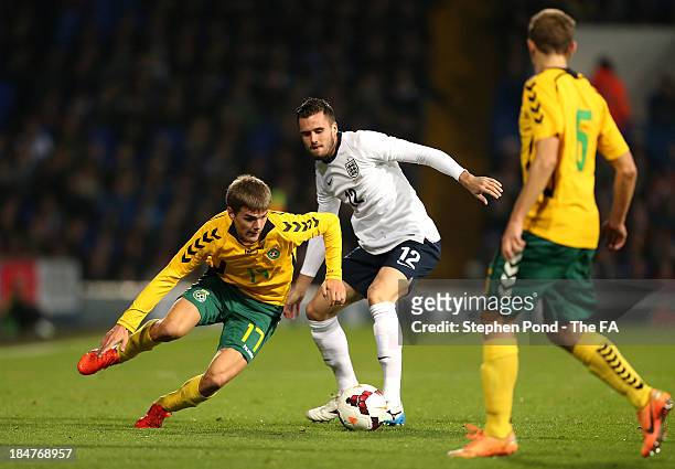 Carl Jenkinson of England challenges Tomas Birskys of Lithuania during the 2015 UEFA European U21 Championships Qualifying Group One match between...
