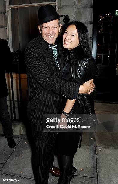 Paul Simonon and Rosey Chan attend the London EDITION and NOWNESS dinner to celebrate ON COLLABORATION on October 14, 2013 in London, England.
