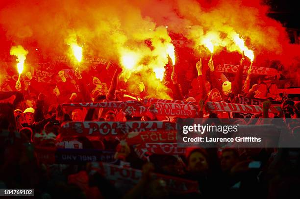 Poland fans light flares prior to the FIFA 2014 World Cup Qualifying Group H match between England and Poland at Wembley Stadium on October 15, 2013...