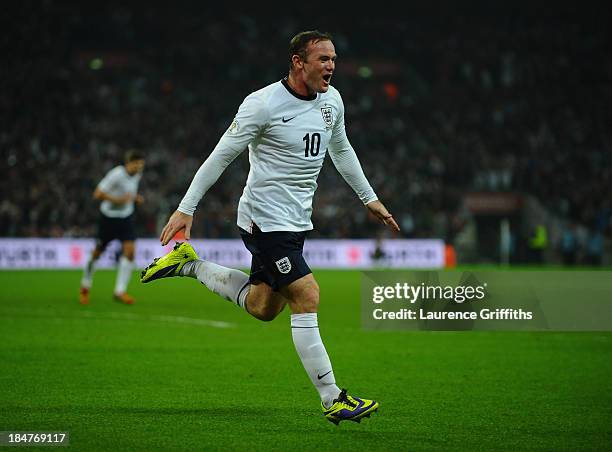 Wayne Rooney of England celebrates after scoring his team's opening goal during the FIFA 2014 World Cup Qualifying Group H match between England and...