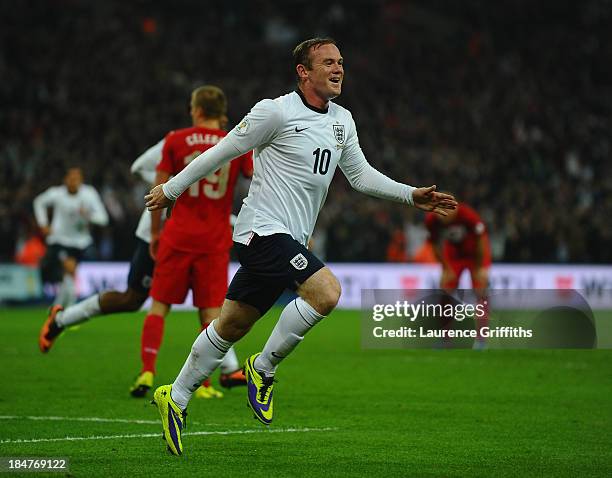 Wayne Rooney of England celebrates after scoring his team's opening goal during the FIFA 2014 World Cup Qualifying Group H match between England and...
