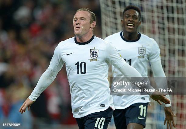 Wayne Rooney of England celebrates with teammate Danny Welbeck after scoring the opening goal during the FIFA 2014 World Cup Qualifying Group H match...