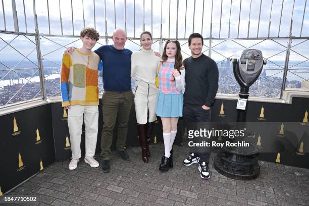 Van Crosby, Simon Cellan Jones, Michelle Monaghan, Zoe Colletti and Mark Wahlberg pose as the cast of Apple TV's “The Family Plan” visits the Empire...