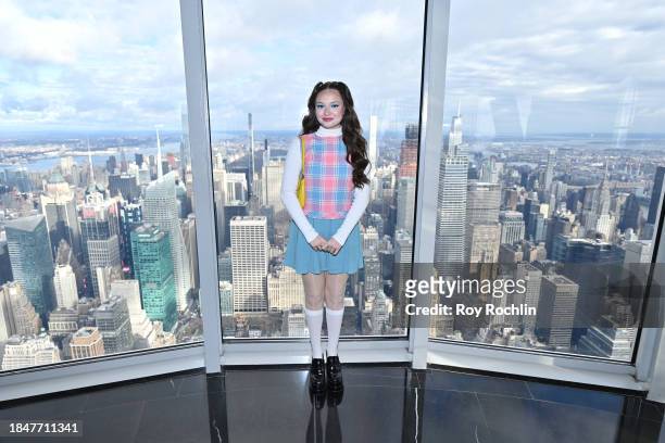 Zoe Colletti poses as the cast of Apple TV's “The Family Plan” visits the Empire State Building at The Empire State Building on December 11, 2023 in...