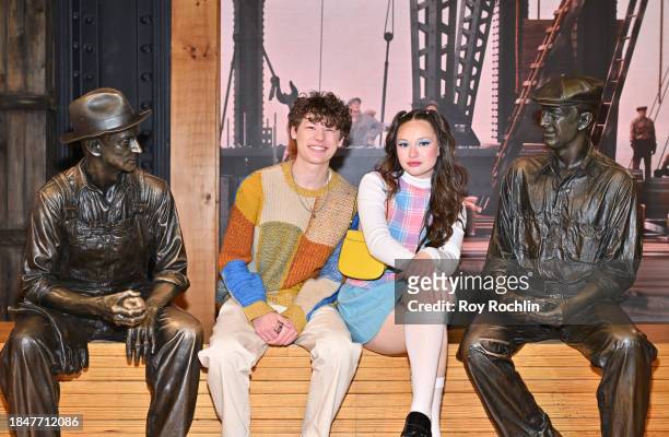 Van Crosby and Zoe Colletti pose as the cast of Apple TV's “The Family Plan” visits the Empire State Building at The Empire State Building on...