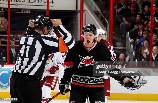 Jeff Skinner of the Carolina Hurricanes protests a call for embellishing during their NHL game against the Phoenix Coyotes at PNC Arena on October...