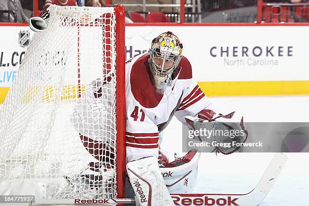 Mike Smith of the Phoenix Coyotes goes down in the crease to protect the net during their NHL game against the Carolina Hurricanes at PNC Arena on...