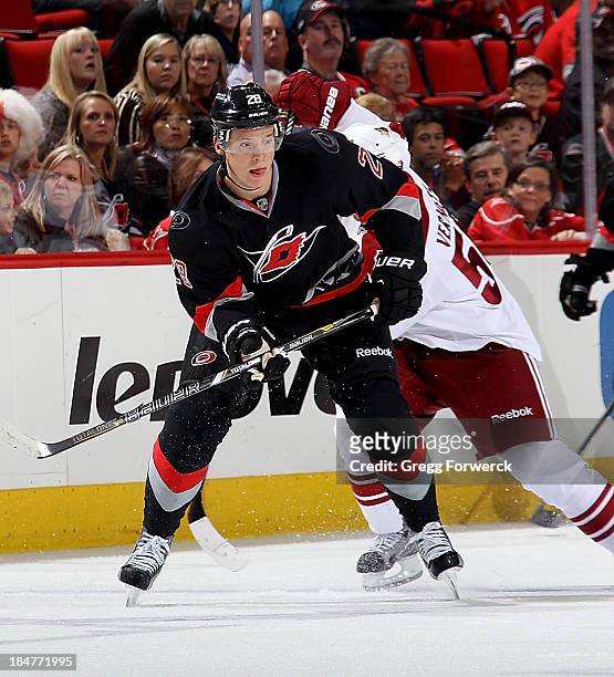 Alexander Semin of the Carolina Hurricanes passes the puck during their NHL game against the Phoenix Coyotes at PNC Arena on October 13, 2013 in...