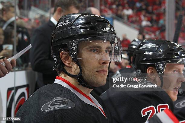 Tuomo Ruutu of the Carolina Hurricanes watches action on the ice from the bench during their NHL game against the Phoenix Coyotes at PNC Arena on...