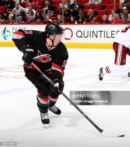 Jeff Skinner of the Carolina Hurricanes skates with the puck against the Phoenix Coyotes during their NHL game at PNC Arena on October 13, 2013 in...