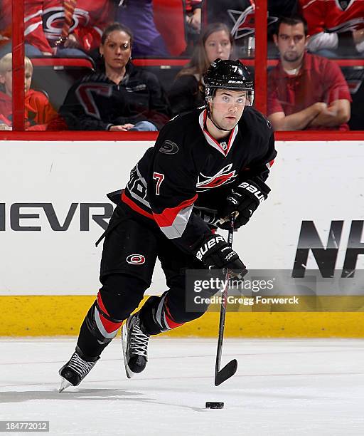 Ryan Murphy of the Carolina Hurricanes skates with the puck against the Phoenix Coyotes during their NHL game at PNC Arena on October 13, 2013 in...