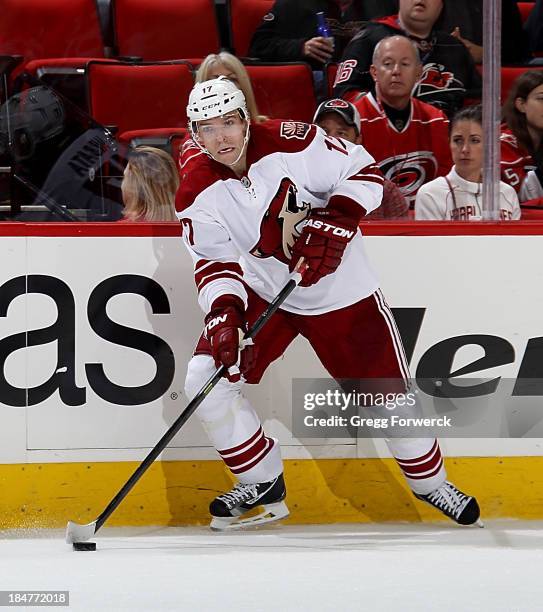 Radim Vrbata of the Phoenix Coyotes looks to pass the puck during their NHL game against the Carolina Hurricanes at PNC Arena on October 13, 2013 in...