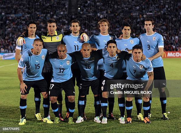 Uruguay's national football team poses for pictures before the start of their Brazil 2014 FIFA World Cup South American qualifier match against...