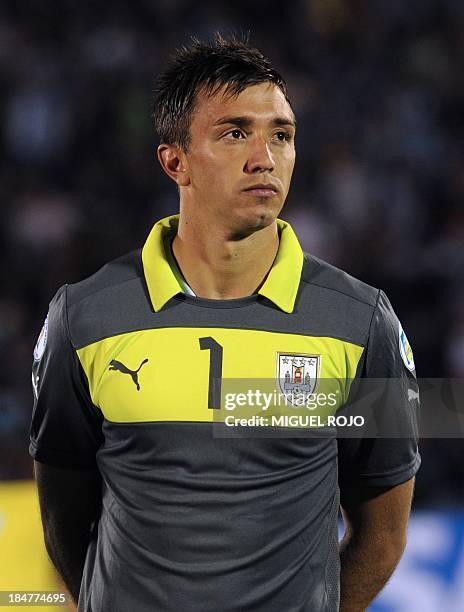 Uruguay's national football team goalkeeper Fernando Muslera listens to the national anthems before the start of the Brazil 2014 FIFA World Cup South...