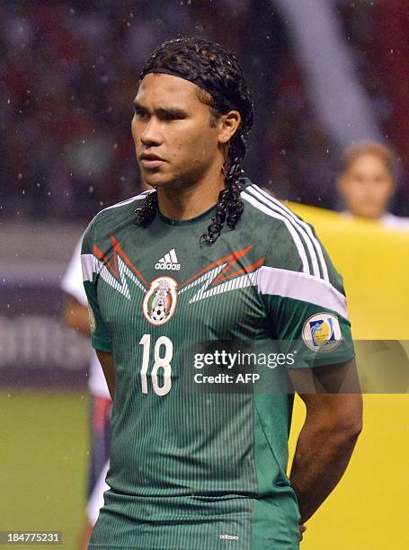 Mexico's national footballer Carlos Pena listens to the national anthems before the start of the Brazil 2014 FIFA World Cup Concacaf qualifier match...