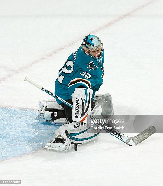 Alex Stalock of the San Jose Sharks warms up before the game against the New York Rangers during an NHL game on October 8, 2013 at SAP Center in San...