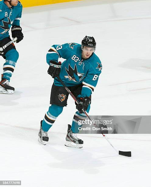 Matthew Nieto of the San Jose Sharks passes the puck against the New York Rangers during an NHL game on October 8, 2013 at SAP Center in San Jose,...