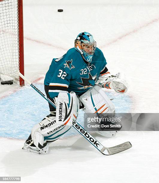 Alex Stalock of the San Jose Sharks warms up before the game against the New York Rangers during an NHL game on October 8, 2013 at SAP Center in San...