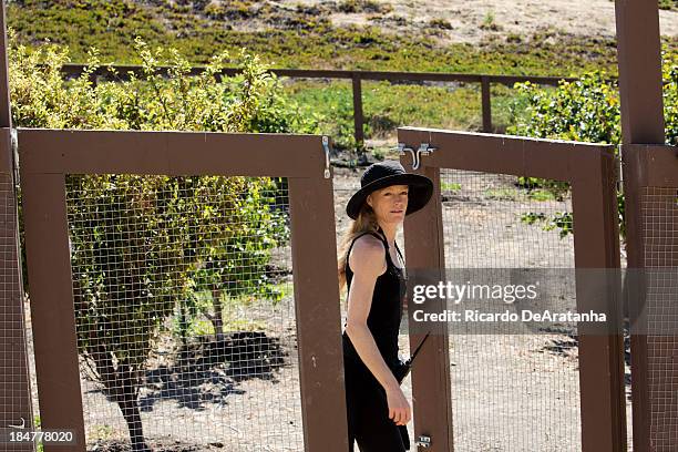 Actress and wife of James Cameron, Suzy Amis is photographed in their family garden at Hollister Ranch for Los Angeles Times on September 24, 2013 in...