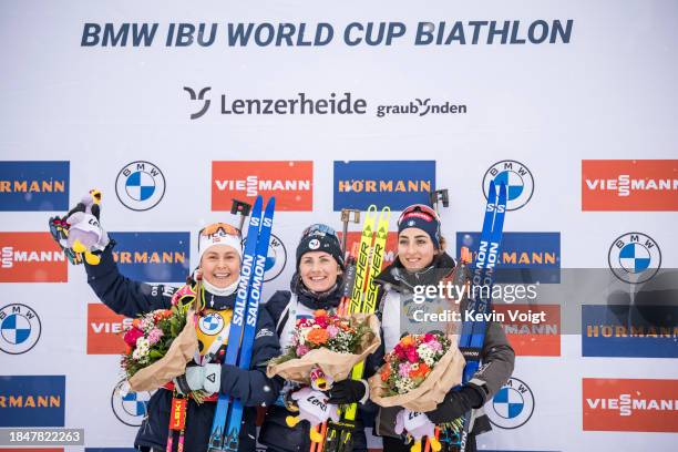 Second placed Ingrid Landmark Tandrevold of Norway, first placed Justine Braisaz-Bouchet of France and third placed Lisa Vittozzi of Italy celebrates...