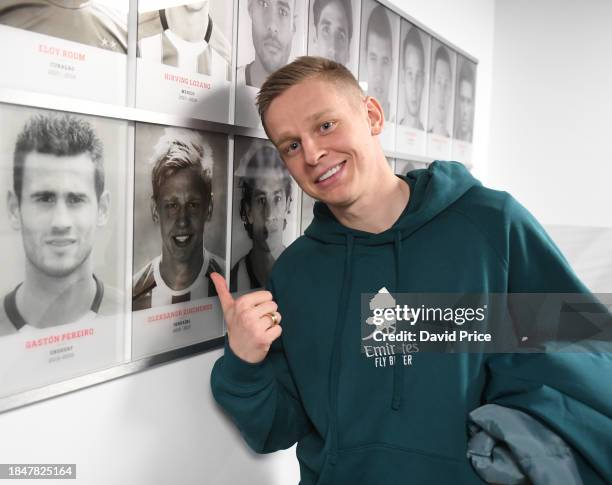 Oleksandr Zinchenko of Arsenal finds a picture of himself on the wall in the PSV stadium during the Arsenal Press Conference at Philips Stadion on...