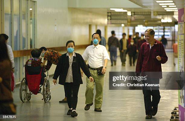 Staff and patients at the Prince of Wales hospital wear face masks in an effort to protect themselves from a deadly and contagious respiratory virus...