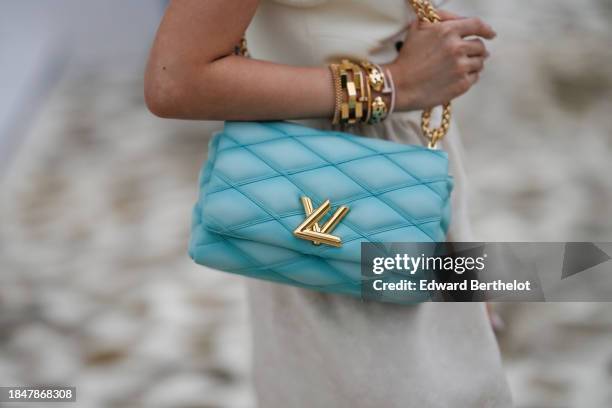 Heart Evangelista wears a Louis Vuitton full look, golden bracelet from Cartier, a blue turquoise quilted leather bag from Louis Vuitton, during a...