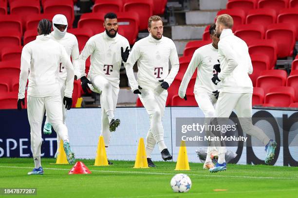 Harry Kane of Bayern Munich warms up with teammates during a training session at Old Trafford on December 11, 2023 in Manchester, England.