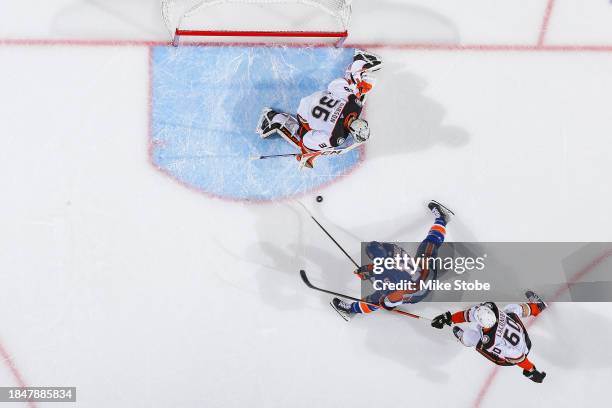 Julien Gauthier of the New York Islanders in action against John Gibson of the Anaheim Ducks at UBS Arena on December 13, 2023 in Elmont, New York....