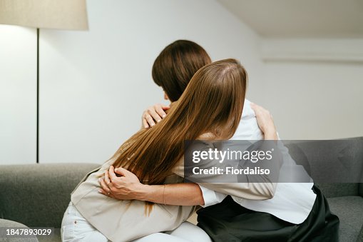Two women in armchairs are sitting and talking Two women in armchairs are sitting and talking