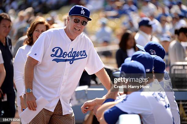 Actor Will Ferrell talks with members of the Los Angeles Dodgers before the Dodgers take on the St. Louis Cardinals in Game Five of the National...