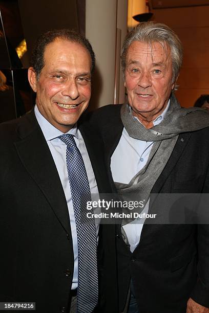 Thierry Dassault and Alain Delon attend the Jean Paul Moureau book signing at Park Hyatt Paris Vendome on October 16, 2013 in Paris, France.