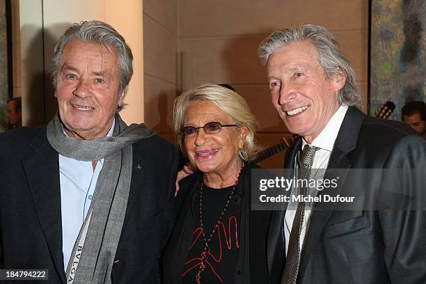 Alain Delon, Veronique De Villele and Jean Paul Moureau attend the Jean Paul Moureau book signing at Park Hyatt Paris Vendome on October 16, 2013 in...