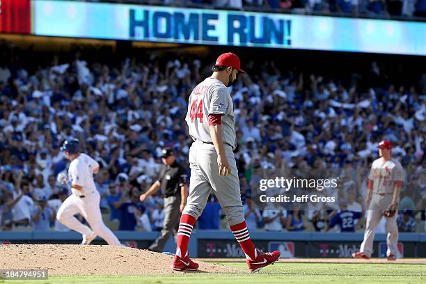 Ellis of the Los Angeles Dodgers rounds the bases after hitting a solo home off Edward Mujica of the St. Louis Cardinals in the seventh inning in...