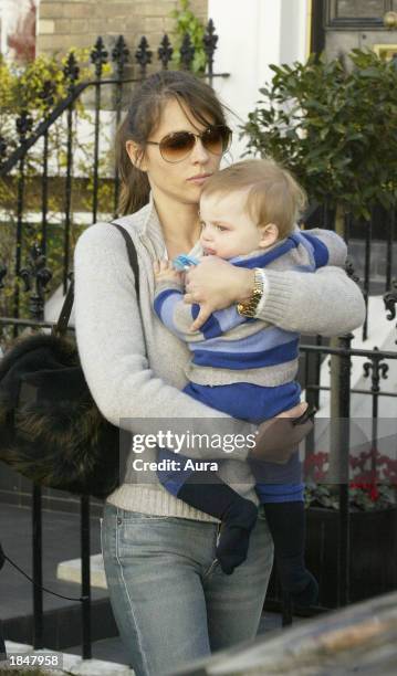 Model and actress Liz Hurley is seen leaving her London home with her son Damian March 14, 2003 in West London. Hurley was heading to Heathrow...