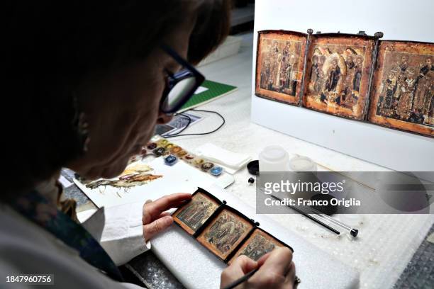 Restorer works on a icon at Vatican Museums Restoration Laboratory during “Beyond the surface. The restorer's gaze": the exhibition initiative...