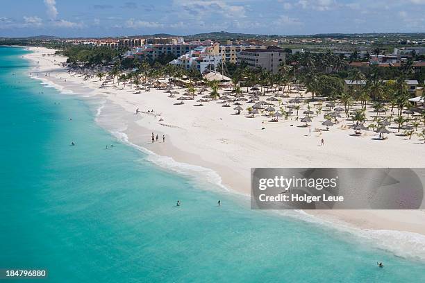 aerial of eagle beach and low-rise hotels - oranjestad stock-fotos und bilder