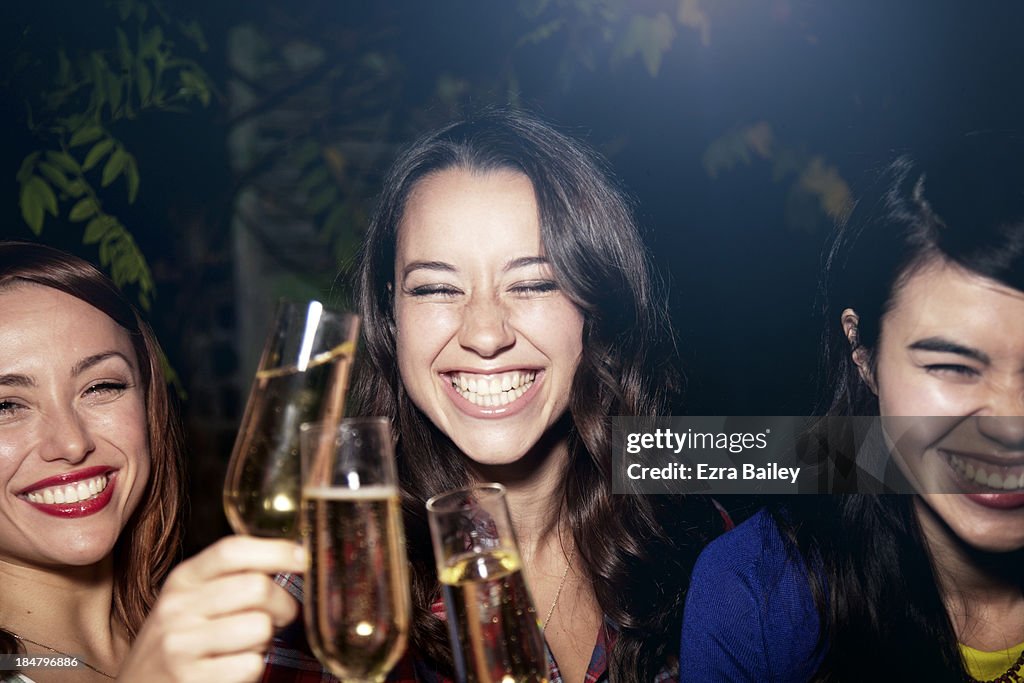 Friends drinking Champagne at a party.