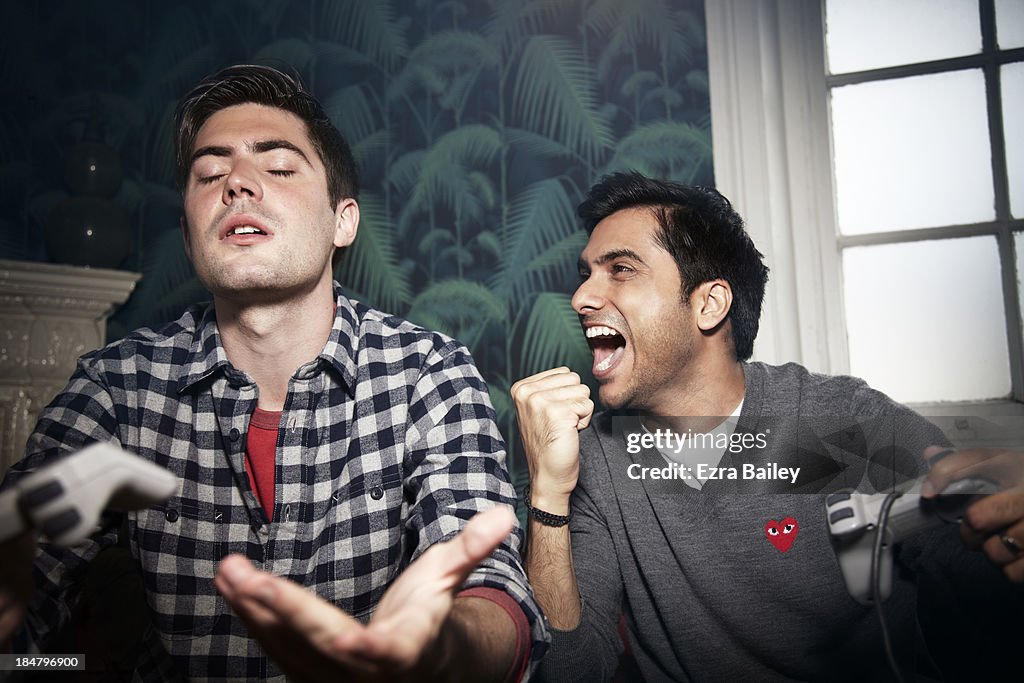 Friends in competition playing games console.