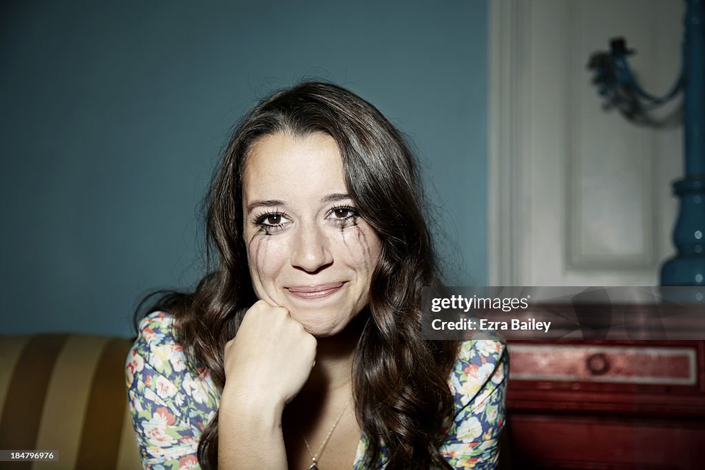 Woman smiling but also crying.