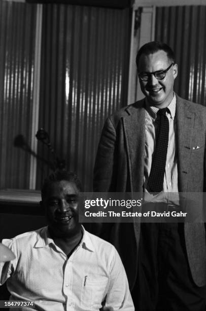Blues, jazz, and boogie woogie pianist Eurreal Wilford 'Little Brother' Montgomery poses for a portrait with American jazz critic, producer, and...