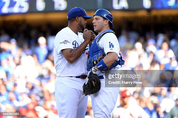 Kenley Jansen and A.J. Ellis of the Los Angeles Dodgers celebrate after the Dodgers defeat the St. Louis Cardinals 6-4 in Game Five of the National...