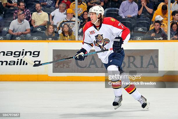 Tom Gilbert of the Florida Panthers plays against the Nashville Predators at Bridgestone Arena on October 15, 2013 in Nashville, Tennessee.